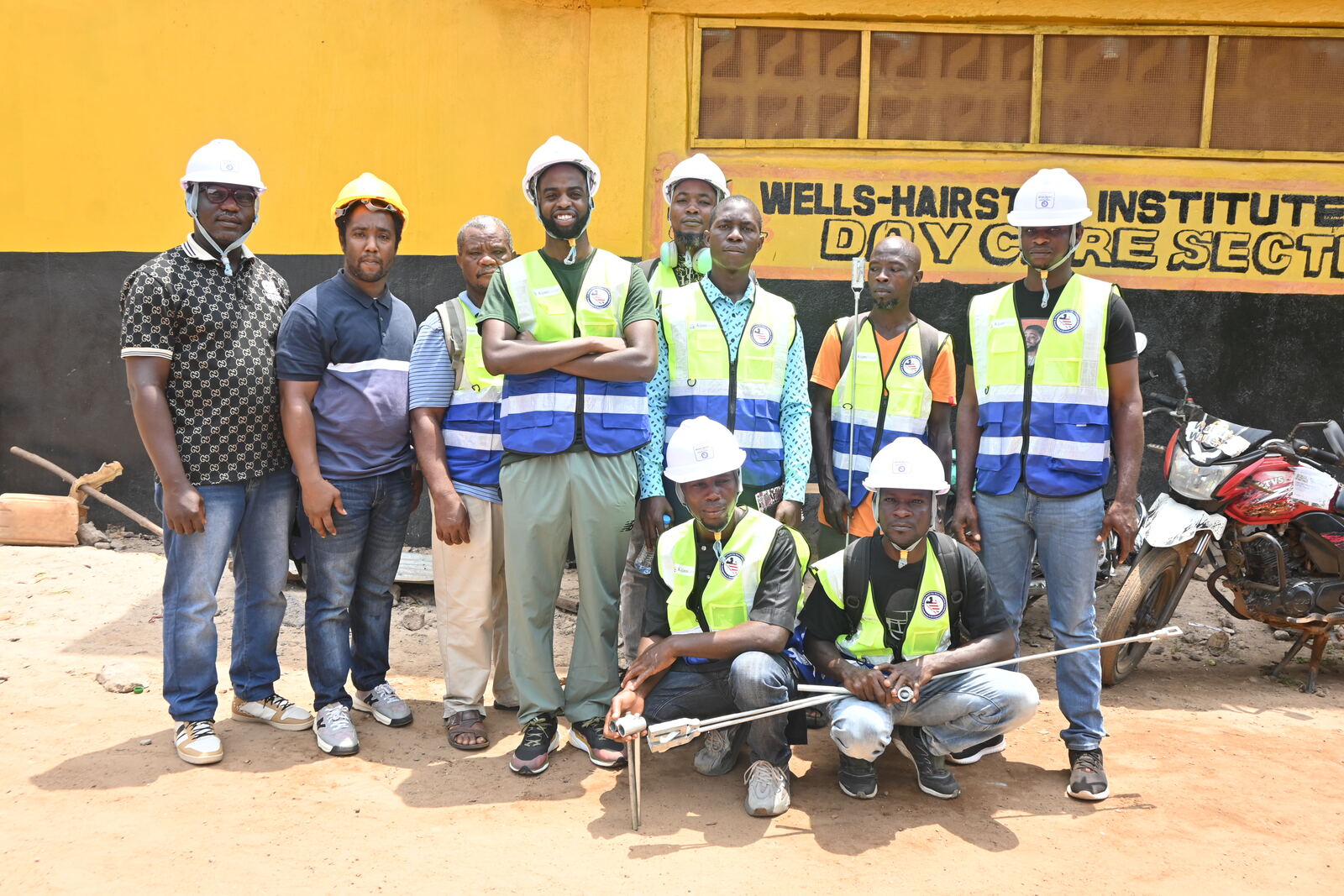 The Liberia field team in hard hats and high-visibility vests