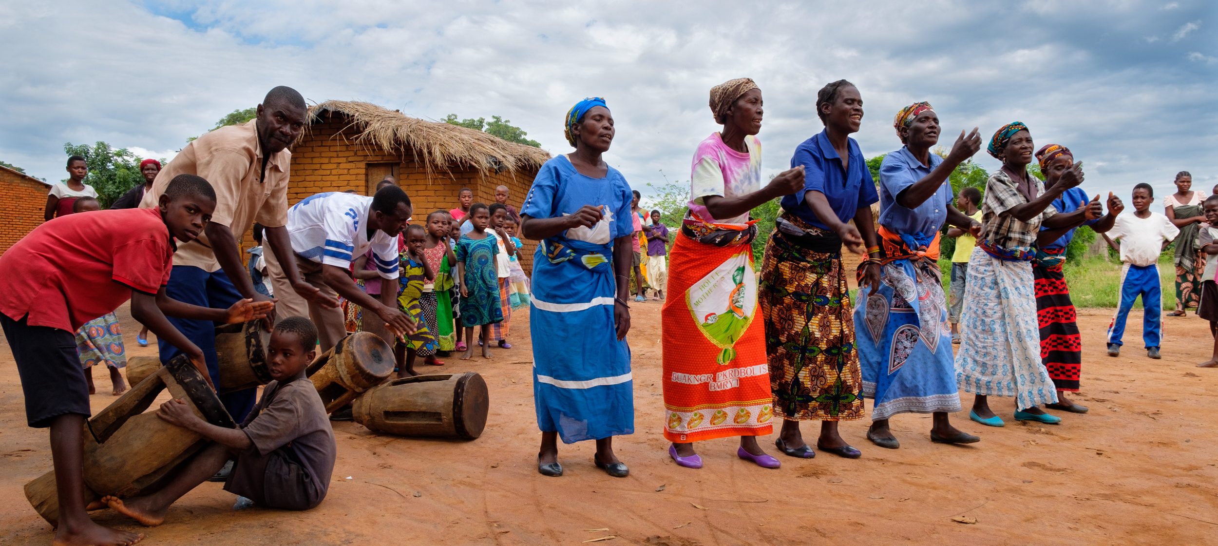Women dancing in celebration after a WaterStep safe water installation